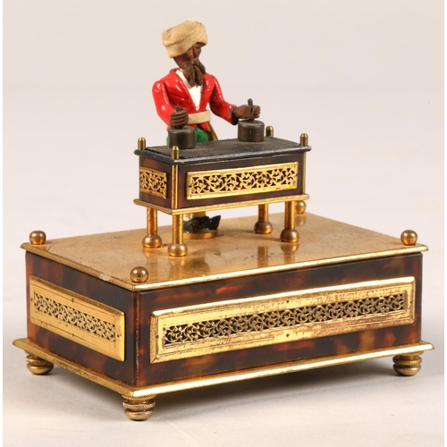 277 - A 19th century Little Conjurer Musical Automaton, in the form of a small bearded man standing behind... 