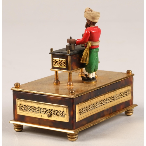 277 - A 19th century Little Conjurer Musical Automaton, in the form of a small bearded man standing behind... 