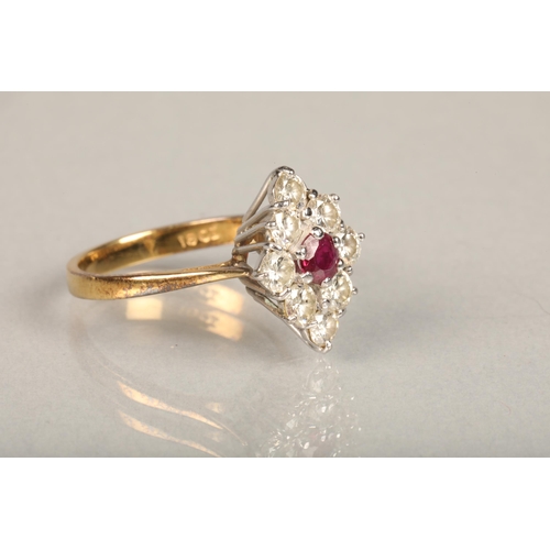 171 - 18ct yellow gold ruby and diamond ring, the central ruby encircled by eight 0.1cts diamond arranged ... 