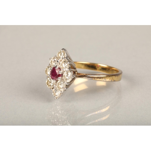 171 - 18ct yellow gold ruby and diamond ring, the central ruby encircled by eight 0.1cts diamond arranged ... 