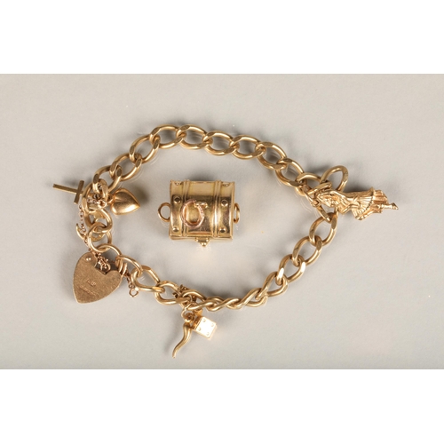 177 - 9ct gold curb link charm bracelet with charms including treasure chest, dice, etc. with heart shaped... 