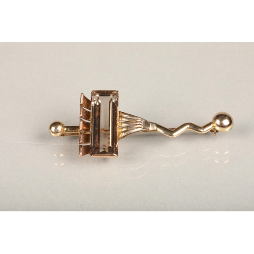 193 - Unhallmarked yellow gold modernist design brooch set with large baguette cut pale smoky quartz, 8.4g... 