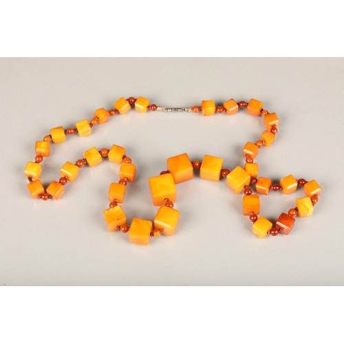 195 - Art Deco style amber coloured necklace formed of cube and sphere beads, 46g gross.