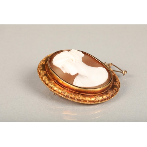 198 - 15ct gold mounted carved cameo shell brooch with portrait of a lady facing left, the border with fil... 