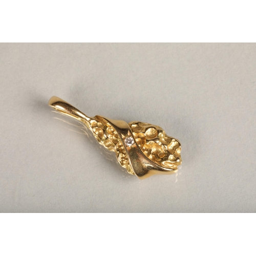 201 - Unhallmarked gold nugget style pendant set with small round diamond, makers mark rubbed possibly 'BT... 