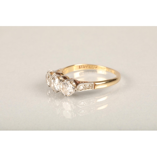 204 - 18ct gold three-stone diamond ring, the central round-cut diamond approx. 0.5ct flanked by two 0.3ct... 