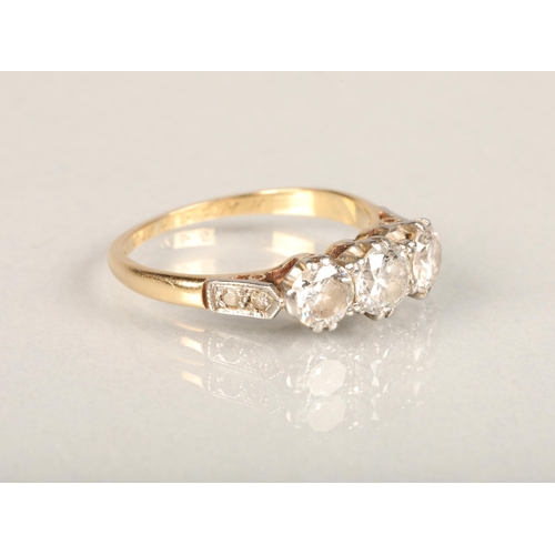 204 - 18ct gold three-stone diamond ring, the central round-cut diamond approx. 0.5ct flanked by two 0.3ct... 