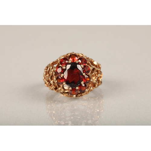 210 - c1970s modernist 9ct gold and garnet cluster ring, the central and surrounding garnet cluster set on... 