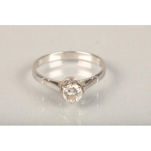 223 - White metal and diamond solitaire ring, the central brilliant cut diamond in eight claw collet setti... 