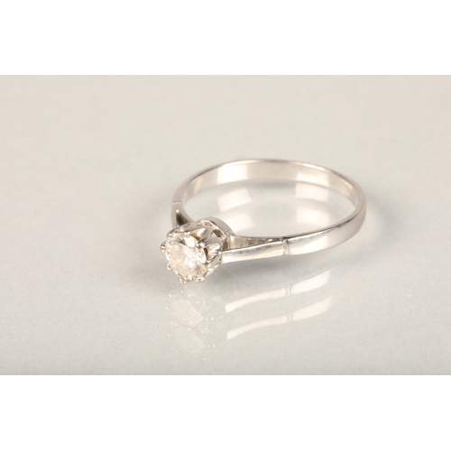 223 - White metal and diamond solitaire ring, the central brilliant cut diamond in eight claw collet setti... 