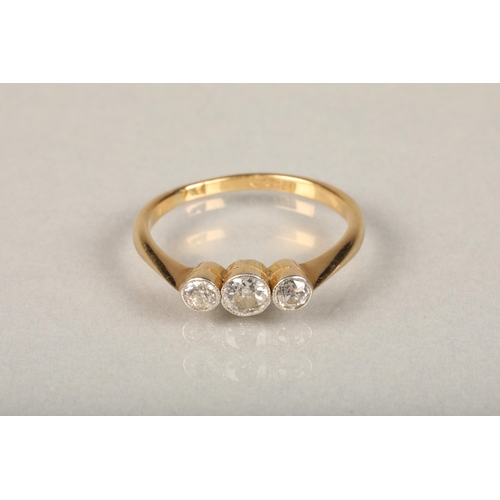 228 - 18ct gold diamond trilogy ring, the three round brilliant cut diamonds bezel set on tapering shoulde... 