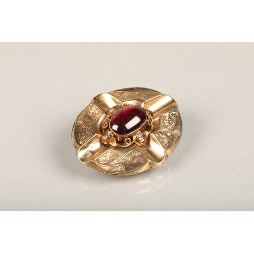 238 - Victorian yellow metal and garnet brooch, the foil backed oval cabochon garnet between a wirework le... 