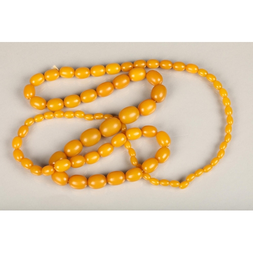 244 - Egg yolk amber or Bakelite beaded necklace, total L99cm, 69g.