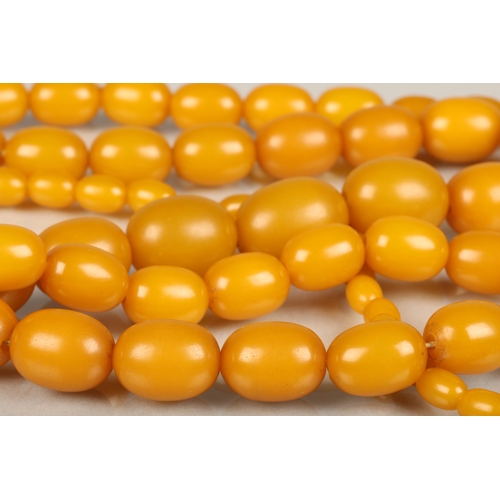 244 - Egg yolk amber or Bakelite beaded necklace, total L99cm, 69g.