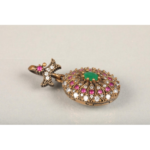 251 - Indian emerald, ruby and white stone oval cluster pendant, the central oval emerald surrounded with ... 