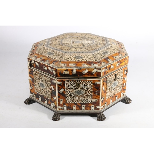 378 - Anglo Indian tortoiseshell and ivory work box, 19th century, of octagonal form on wooden lion paw fe... 