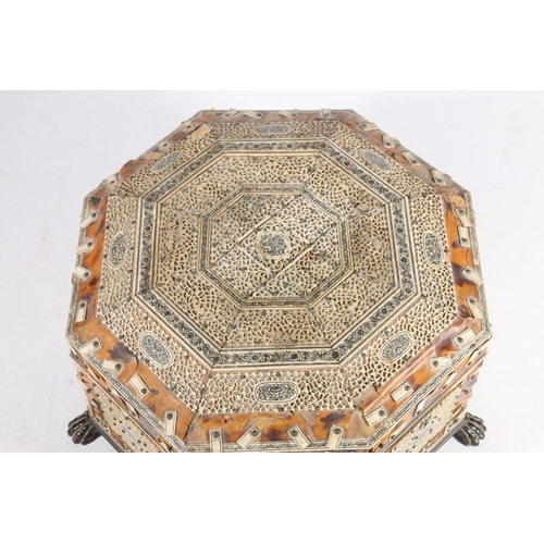 378 - Anglo Indian tortoiseshell and ivory work box, 19th century, of octagonal form on wooden lion paw fe... 