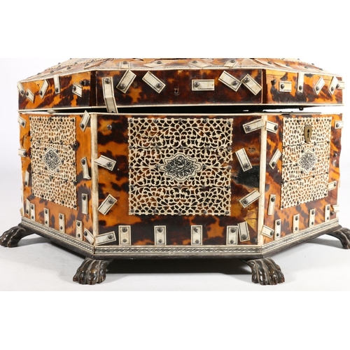 378 - Anglo Indian tortoiseshell and ivory work box, 19th century, of octagonal form on wooden lion paw fe... 