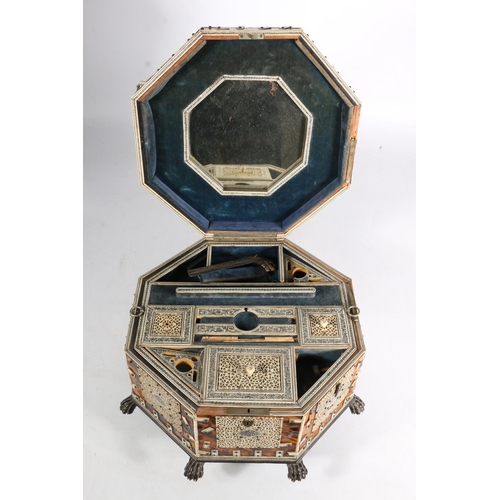 378 - Anglo Indian tortoiseshell and ivory work box, 19th century, of octagonal form on wooden lion paw fe... 