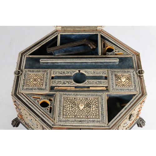 378 - Anglo Indian tortoiseshell and ivory work box, 19th century, of octagonal form on wooden lion paw fe... 