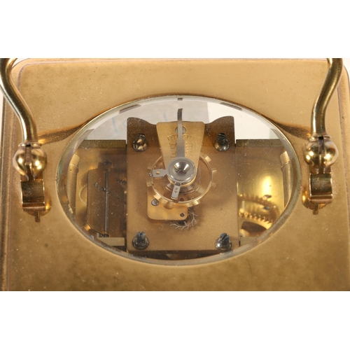 385 - Early 20th century brass carriage clock timepiece, the cream porcelain chapter ring dial with Arabic... 