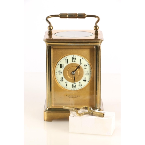 385 - Early 20th century brass carriage clock timepiece, the cream porcelain chapter ring dial with Arabic... 