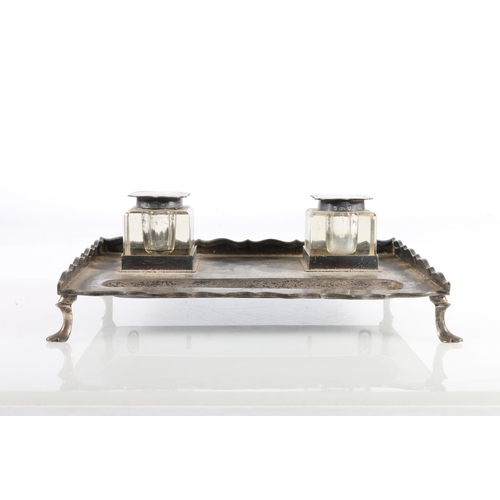 56 - George V silver inkstand, the pad footed galleried base inset with two matching glass and silver top... 