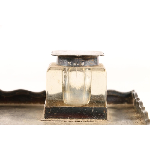 56 - George V silver inkstand, the pad footed galleried base inset with two matching glass and silver top... 