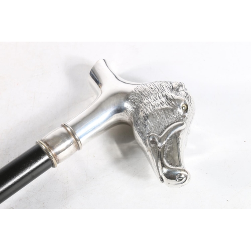 60 - Silver handled walking cane in the form of a boar's head, marked 925, together with two white metal ... 