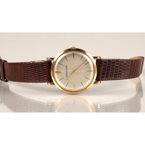 125 - Gents 9ct gold Jaeger-le-coultre wrist watch, on a brown leather strap.