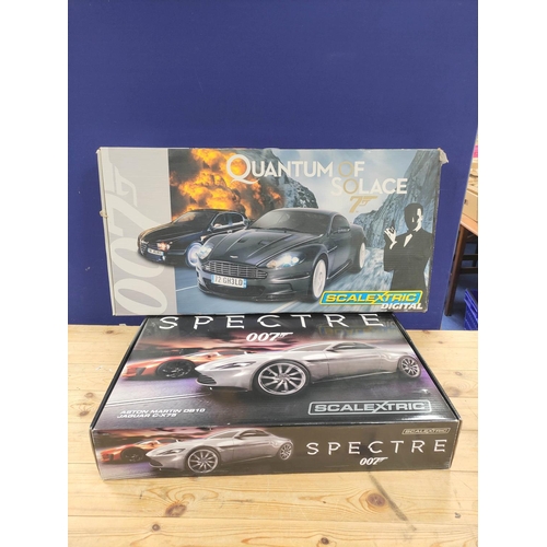 Two boxed James Bond 007 related Scalextric sets to include Spectre Aston Martin DB10 Jaguar C