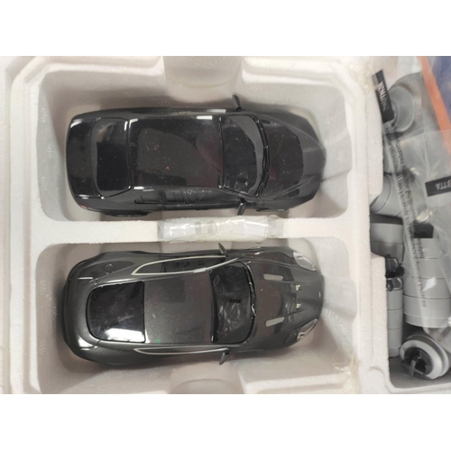 118 - Two boxed James Bond 007 related Scalextric sets to include Spectre Aston Martin DB10 & Jaguar C... 