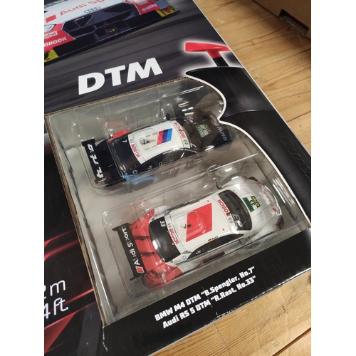 121 - Carrera Evolution BMW M4 DTM and Audi RS 5 DTM boxed racing set 20025239. 