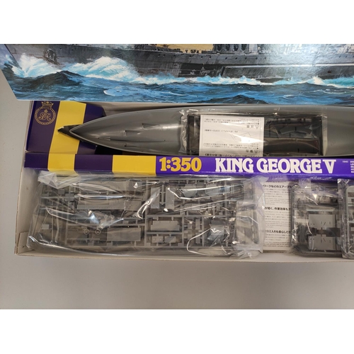 129 - Two boxed 1:350 scale model ships to include a Tamiya British Battleship King George V No.10, and a ... 