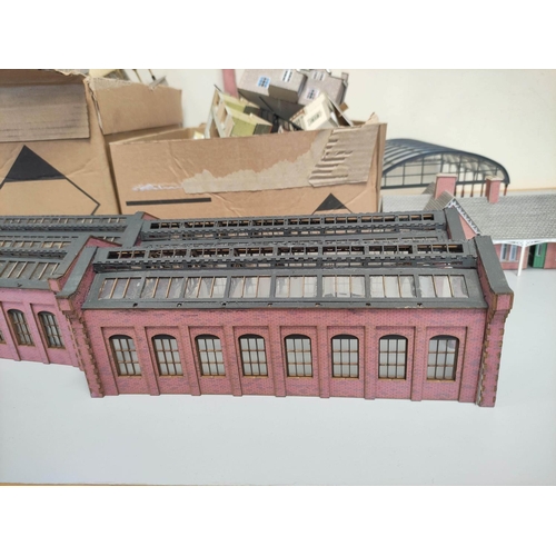 266 - Two boxes of model railway buildings and track components to include a factory, glass station roof e... 