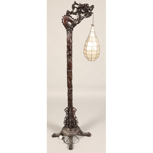 512 - Oriental style carved hardwood free standing lamp in the form of a dragon, with droplet leaded lamp,... 