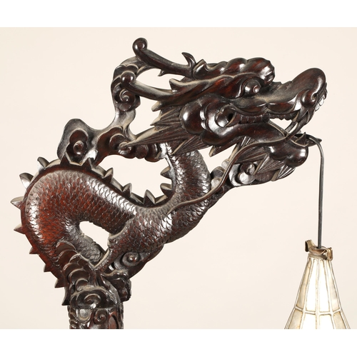 512 - Oriental style carved hardwood free standing lamp in the form of a dragon, with droplet leaded lamp,... 