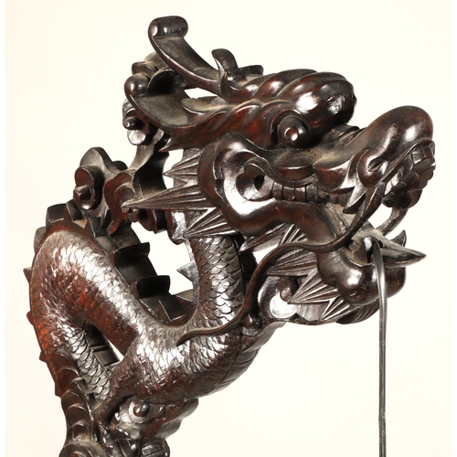 512 - Oriental style carved hardwood free standing lamp in the form of a dragon, with droplet leaded lamp,... 