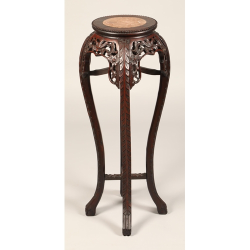 517 - Chinese carved hardwood jardiniere stand, with rouge marble insert, with carved apron and under stre... 