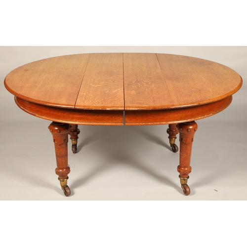 533 - Victorian oak telescope table, eight matching chairs and carved oak sideboard.