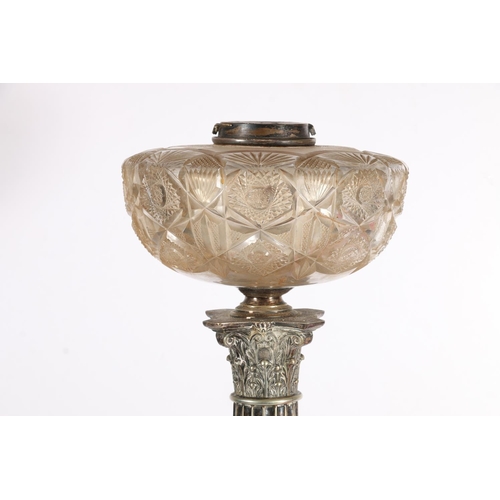 384 - Victorian silver plated Corinthian column oil lamp base, the cranberry glass shade over clear cut gl... 