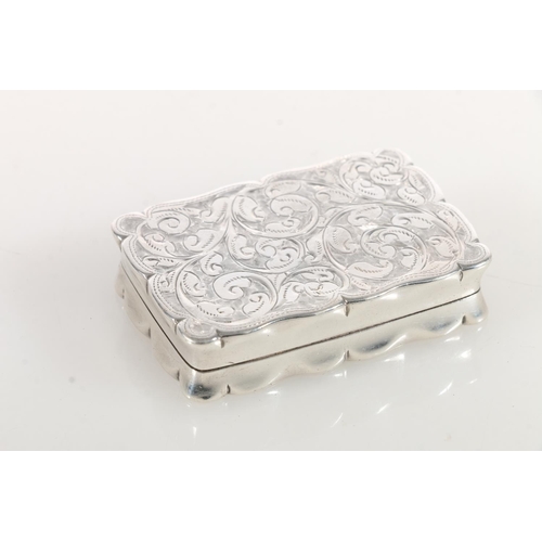 65 - Edward VII silver snuff box of rectangular form with shaped edges, the body engraved with scrolled a... 