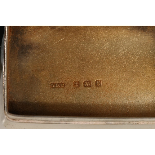 65 - Edward VII silver snuff box of rectangular form with shaped edges, the body engraved with scrolled a... 