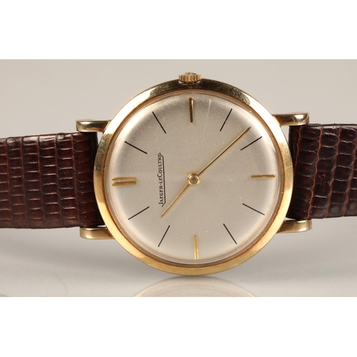 125 - Gents 9ct gold Jaeger-le-coultre wrist watch, on a brown leather strap.