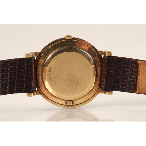 125 - Gents 9ct gold Jaeger-le-coultre wrist watch, on a brown leather strap.