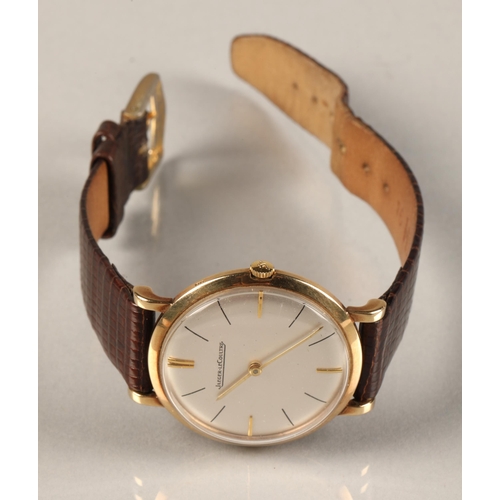 125 - Gents 9ct gold Jaeger-le-coultre wrist watch, on a brown leather strap.