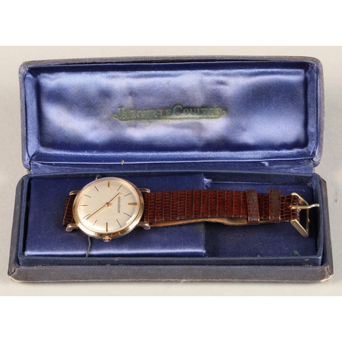 125 - Gents 9ct gold Jaeger-le-coultre wrist watch, on a brown leather strap.