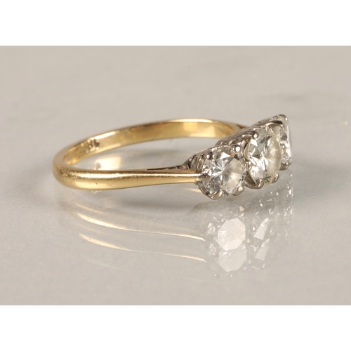 57 - Ladies 18ct yellow gold three stone diamond ring, central stone 0.5 carat with 0.33 carat stone at e... 