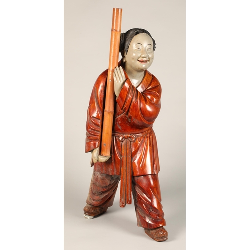 223 - Japanese wooden carved figure, 76cm high.