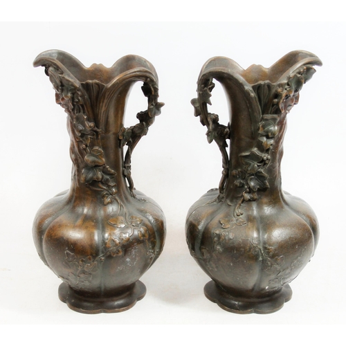 380 - After Charles Georges Ferville-Suan (French 1847-1925), a pair of bronzed spelter ewers, the cast bo... 